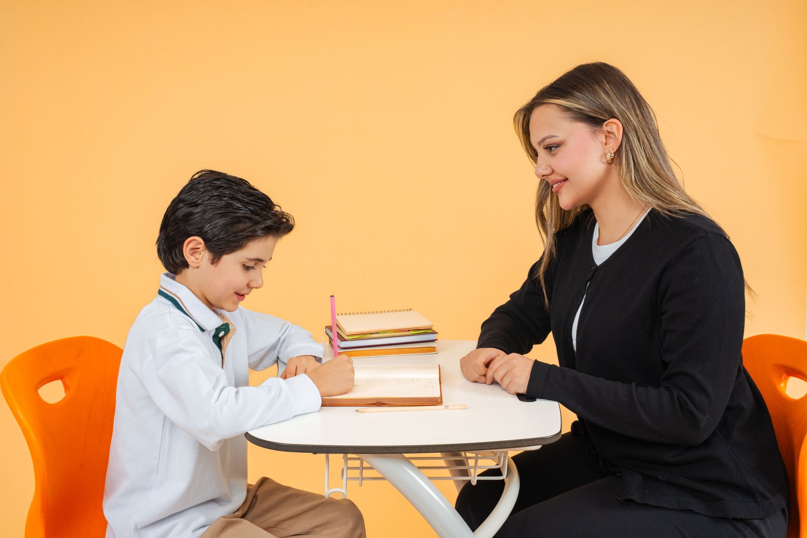 Teacher helping student